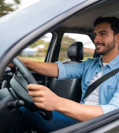 man driving car