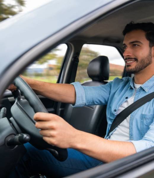man driving car